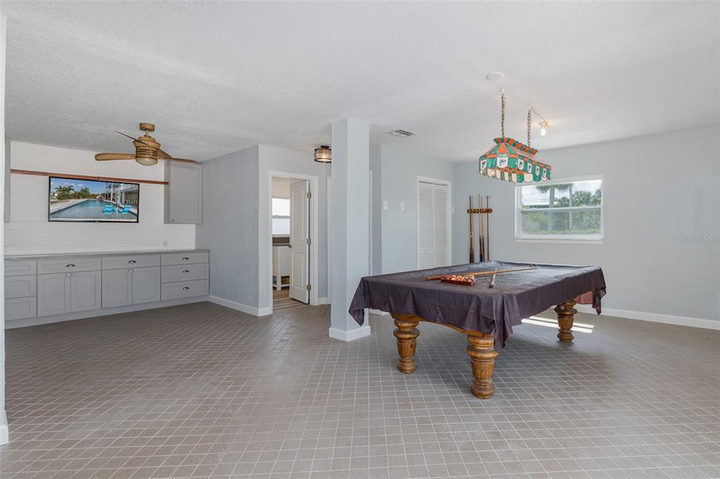 5040 Waterside Drive Port Richey, FL 34668 - Photo 38 of 58 a room with a table and chairs