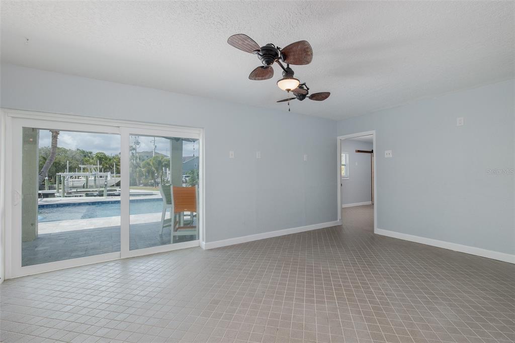 5040 Waterside Drive Port Richey, FL 34668 - Photo 40 of 58 a view of a livingroom with a ceiling fan and window
