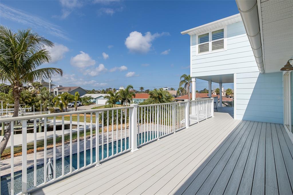 5040 Waterside Drive Port Richey, FL 34668 - Photo 50 of 58 a view of a balcony with wooden floor and fence