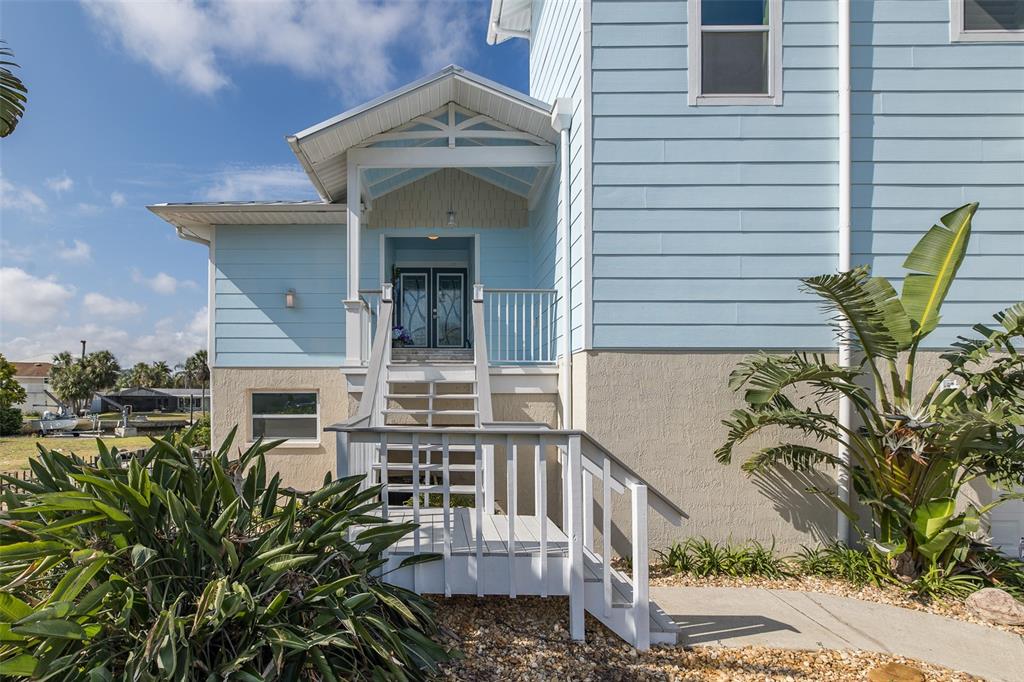 5040 Waterside Drive Port Richey, FL 34668 - Photo 5 of 58 a view of a chair and table in the balcony