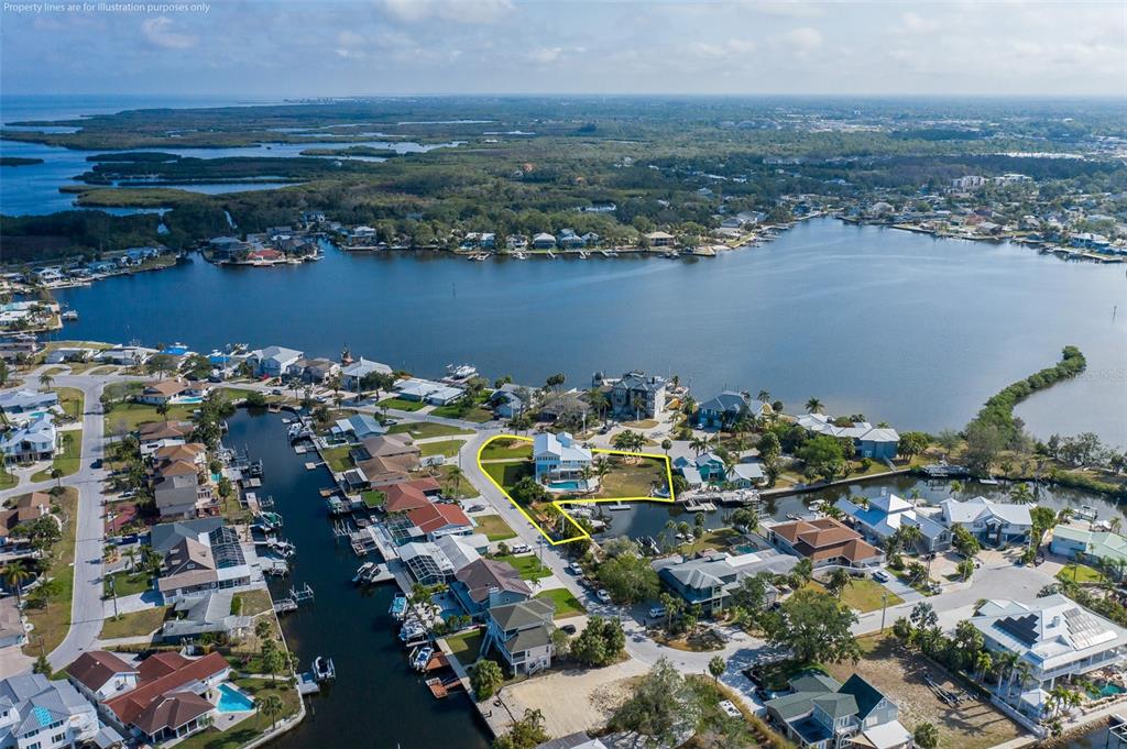 5040 Waterside Drive Port Richey, FL 34668 - Photo 53 of 58 an aerial view of a city with ocean view