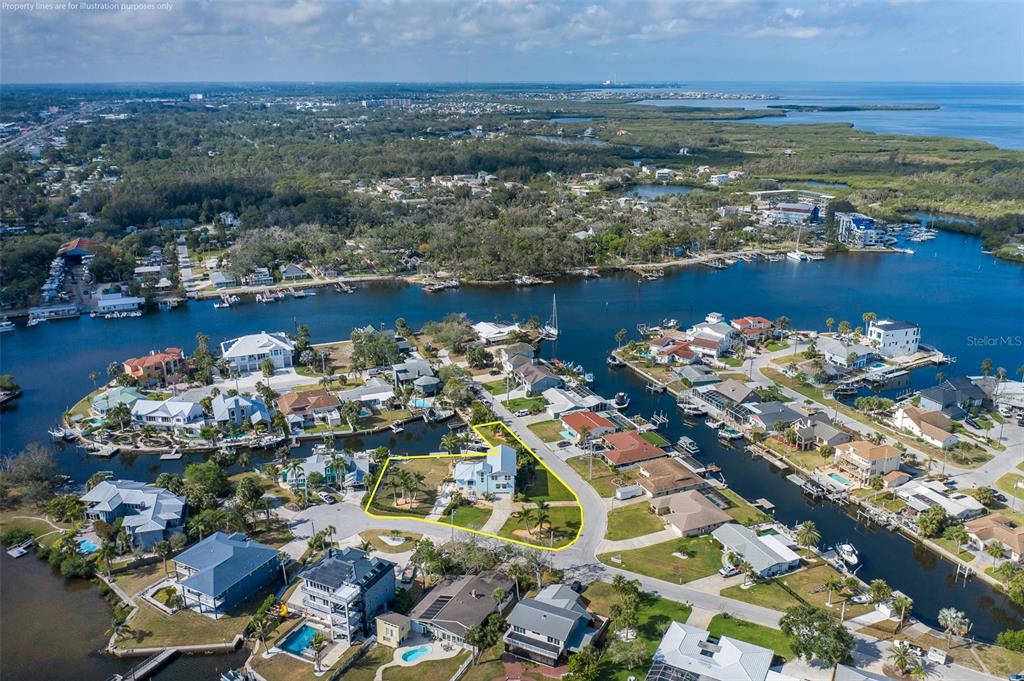 5040 Waterside Drive Port Richey, FL 34668 - Photo 54 of 58 an aerial view of a houses with a lake view