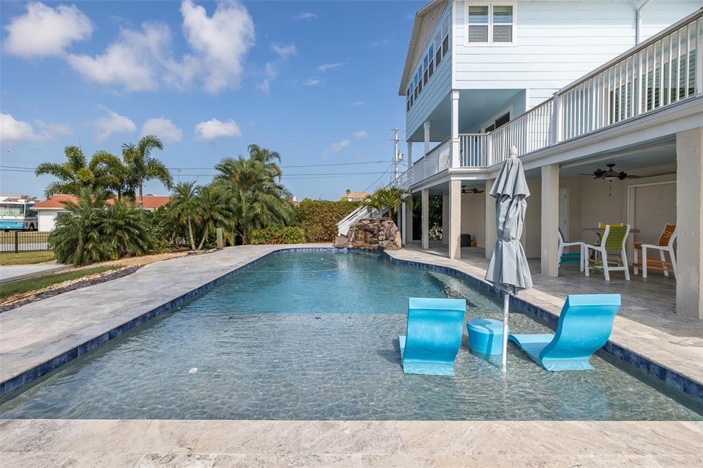 5040 Waterside Drive Port Richey, FL 34668 - Photo 6 of 58 a view of a swimming pool with sitting area