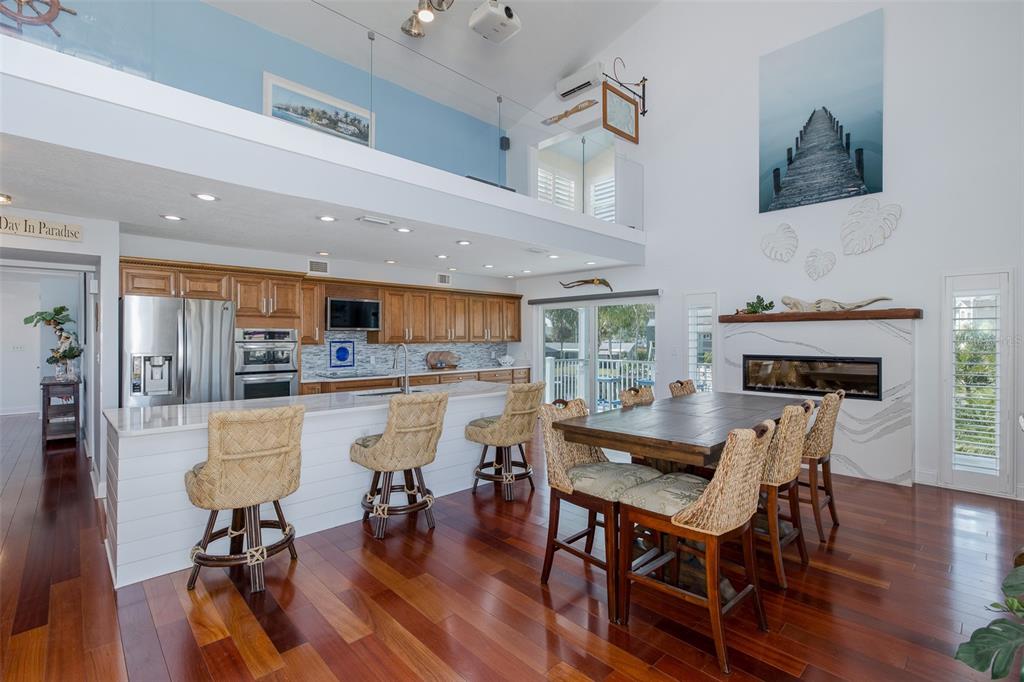 5040 Waterside Drive Port Richey, FL 34668 - Photo 10 of 58 a dining room with furniture and wooden floor