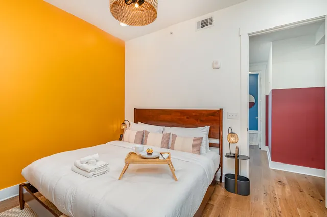 a bedroom with a bed and a cabinets