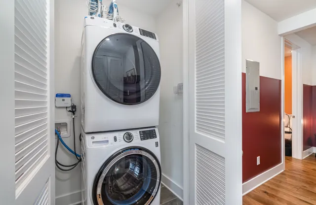 a view of a hallway with washer and dryer