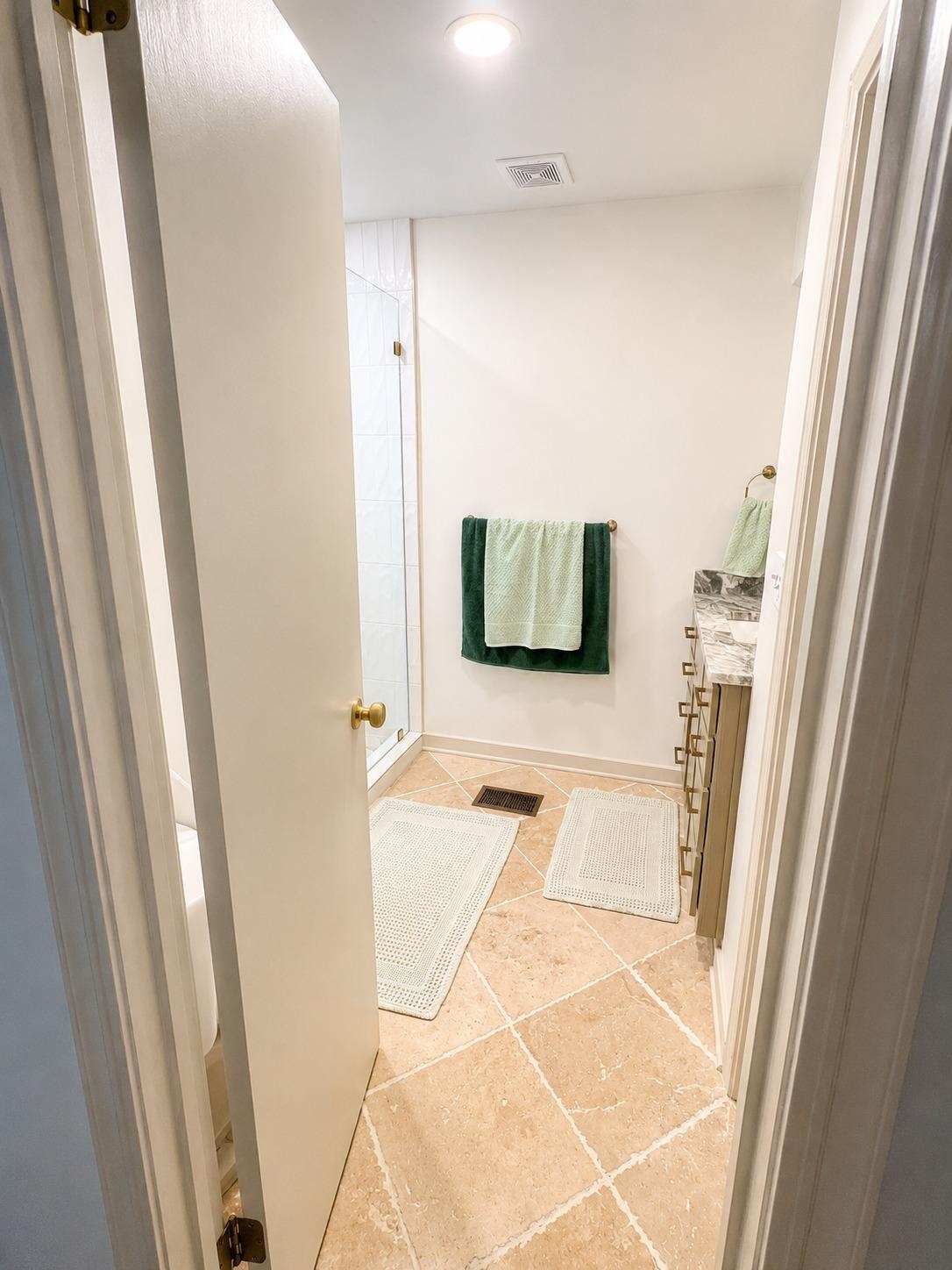 470 Rich Road Somerville, TN 38068 - Photo 27 of 40 Bathroom featuring diagonal tile flooring, a glass-enclosed shower, and a vanity with a stone countertop