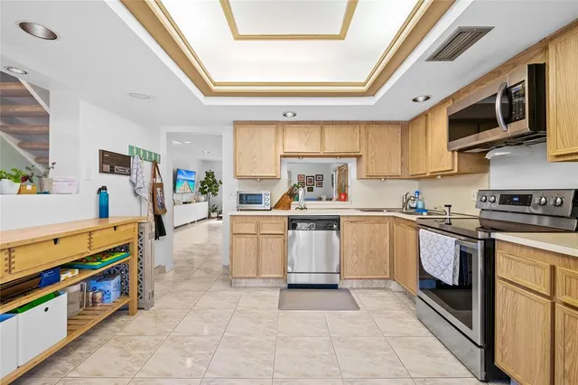 a kitchen with stainless steel appliances granite countertop a stove and a sink