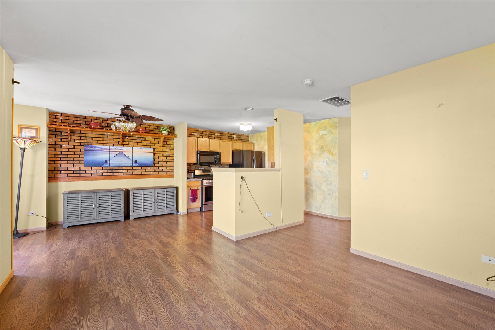 639 Chestnut Ridge Minooka, IL 60447 - Photo 6 of 31 a living room with stainless steel appliances wooden floor and a large window