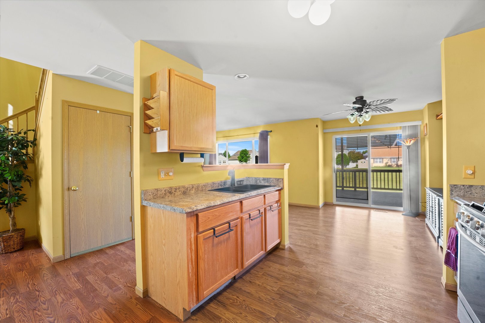 639 Chestnut Ridge Minooka, IL 60447 - Photo 8 of 31 a kitchen with a stove and wooden floor