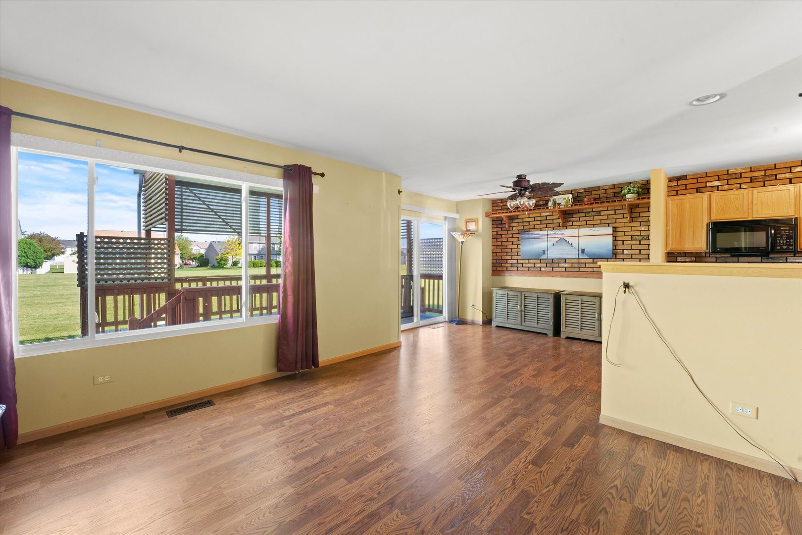 639 Chestnut Ridge Minooka, IL 60447 - Photo 10 of 31 a view of a kitchen with wooden floor and electronic appliances