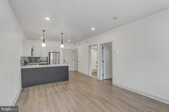 a view of kitchen and wooden floor