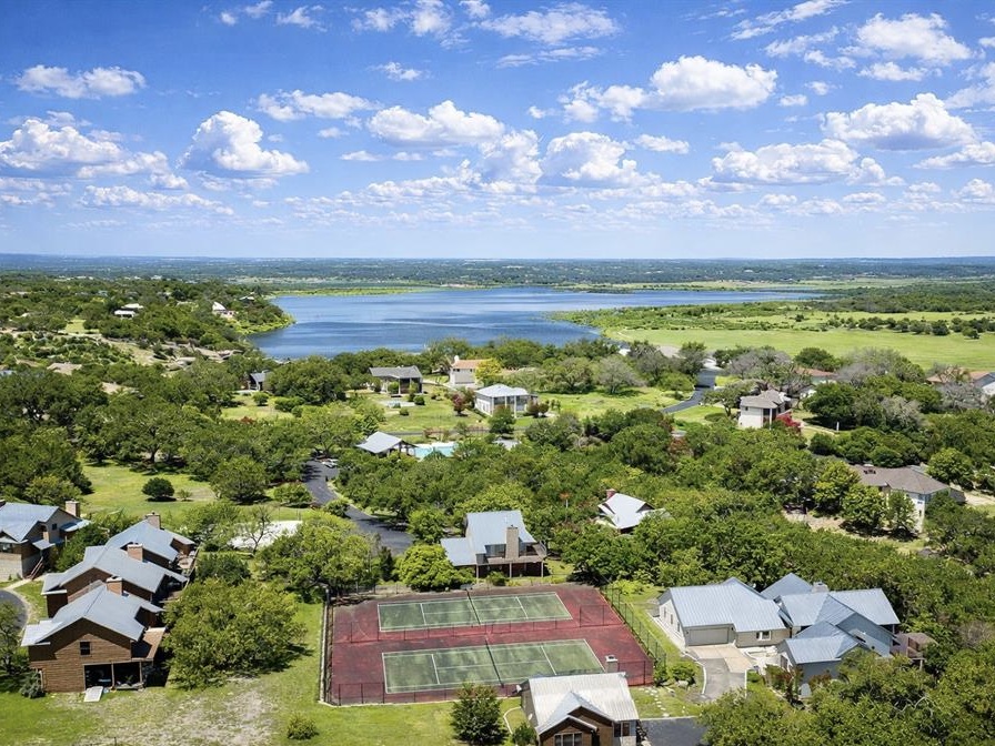 300 Wesley Ridge Drive Spicewood, TX 78669 - Photo 29 of 40 Community tennis and pickleball courts set within the natural Hill Country landscape of Ridge Harbor.