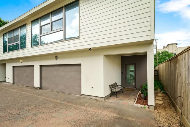 a view of backyard and front door