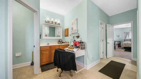 a view of living room with furniture and a chandelier