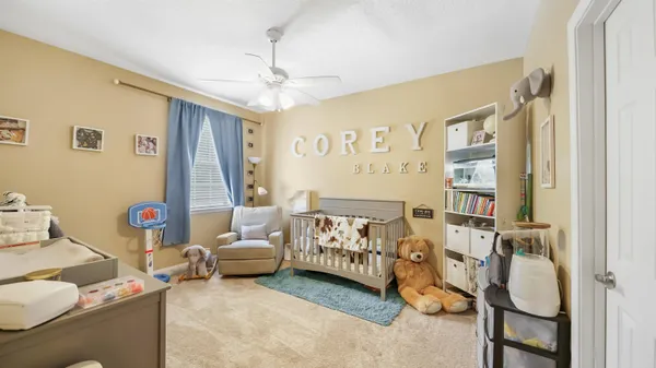 a bedroom with furniture and a chandelier