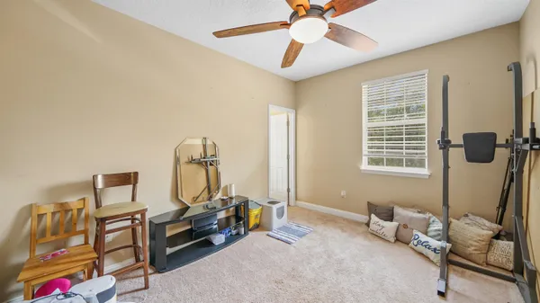 a bedroom with furniture and a window