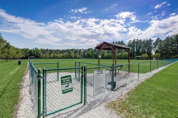 a view of a park with swings and slides