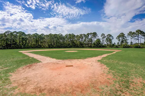 a view of a golf course with a lake