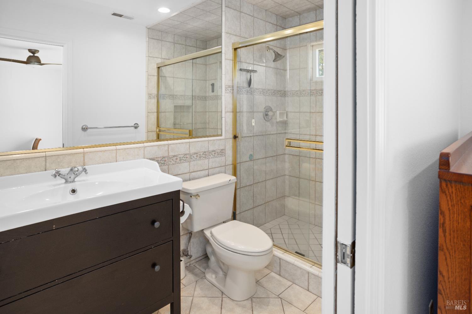 4808 Foxglove Court Santa Rosa, CA 95405 - Photo 11 of 26 a bathroom with a sink a toilet and shower