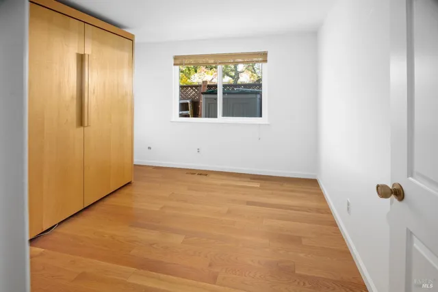 a view of an empty room with windows