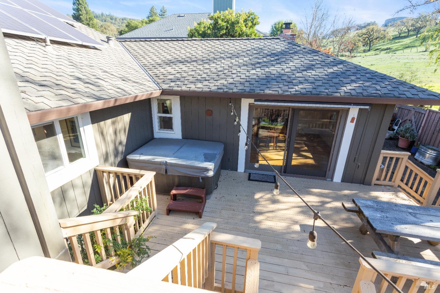 4808 Foxglove Court Santa Rosa, CA 95405 - Photo 20 of 26 a view of a patio with a table and chairs and wooden floor