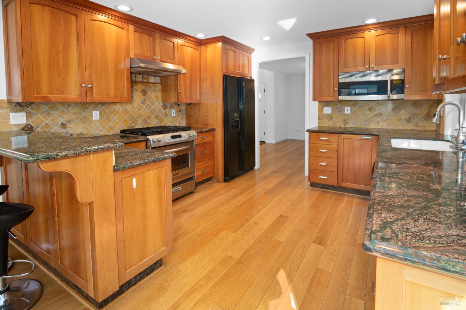 4808 Foxglove Court Santa Rosa, CA 95405 - Photo 6 of 26 a kitchen with stainless steel appliances granite countertop a granite counter tops and a stove