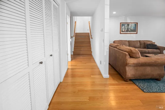 a living room with furniture and a rug
