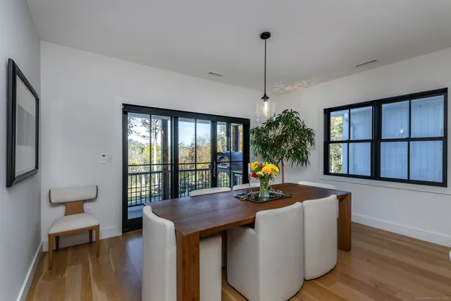 a view of a living room and dining room