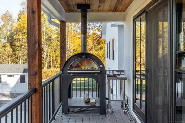 a view of living room with a door and wooden floor