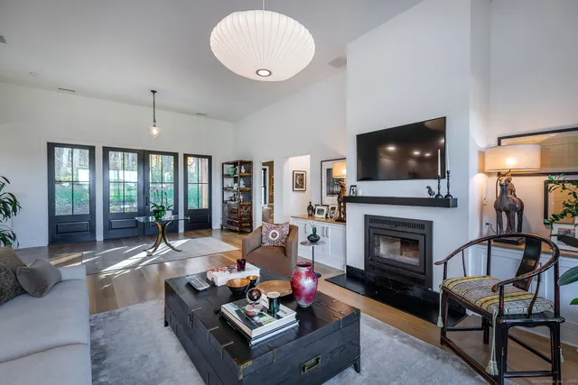 a living room with furniture fireplace and flat screen tv
