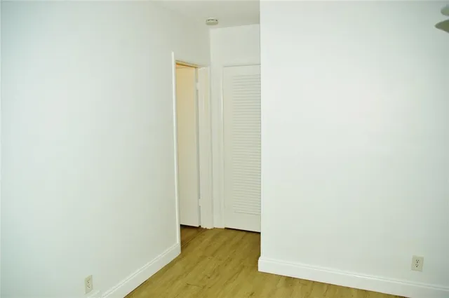 a view of room with wooden floor