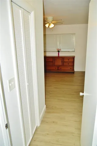 a view of a room with wooden floor