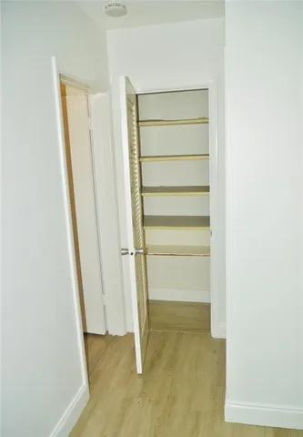 a view of a brick wall with a small space