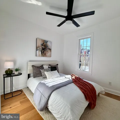a bedroom with bed and a window