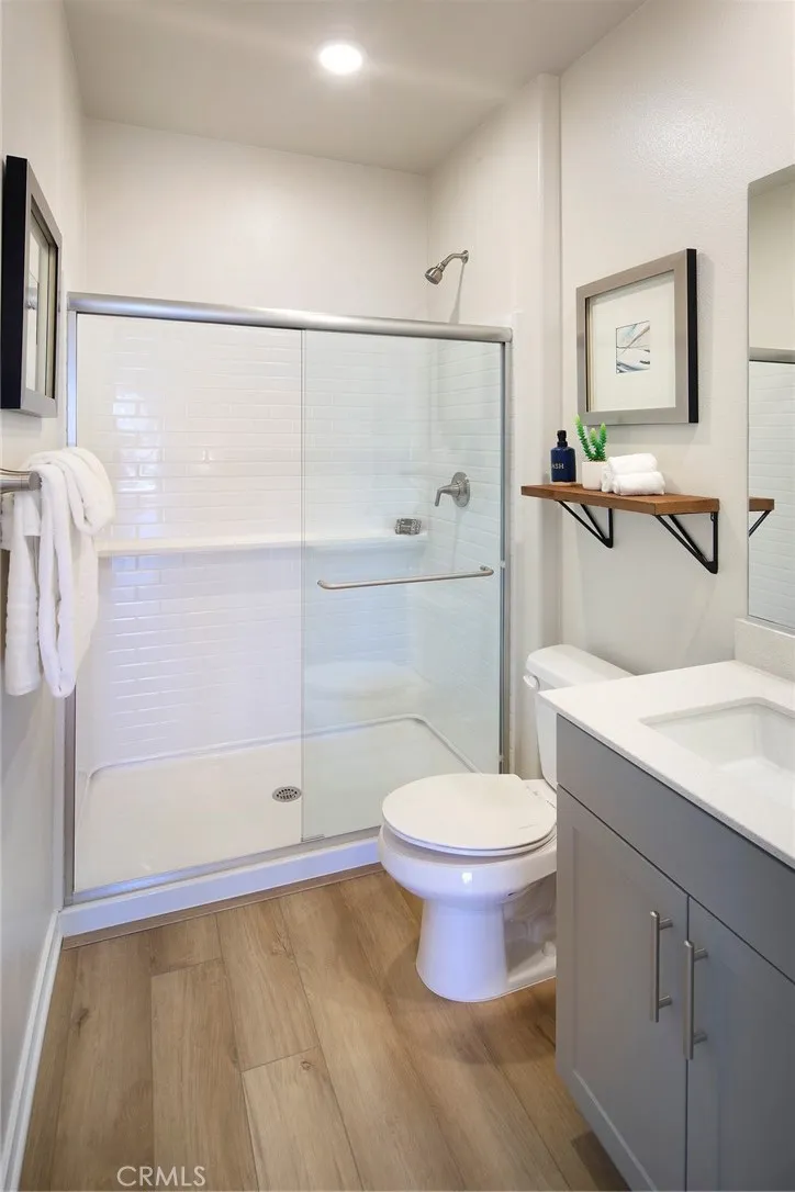 9523 Hannah Way Riverside, CA 92505 - Photo 21 of 26 a bathroom with a toilet sink and shower