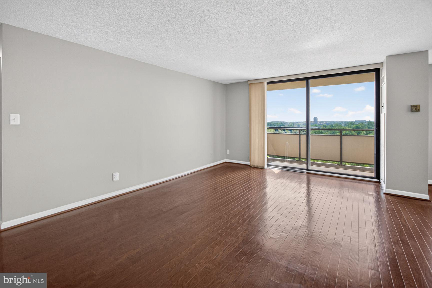 5225 Pooks Hill Road, Unit 1404S Bethesda, MD 20814 - Photo 4 of 29 Living Room w/Balcony