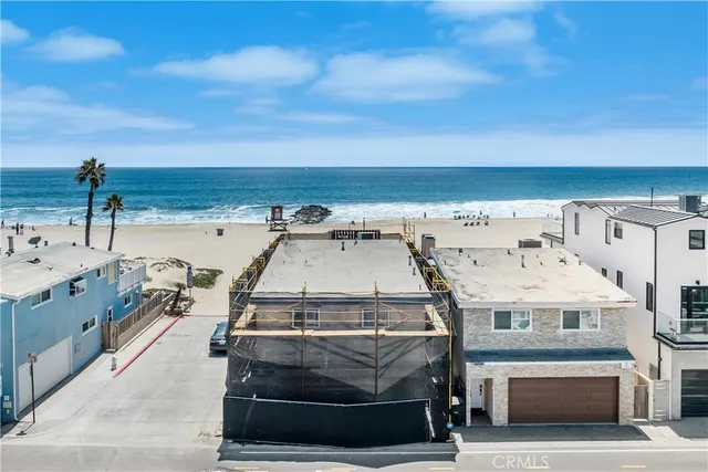 an aerial view of a house with a big yard