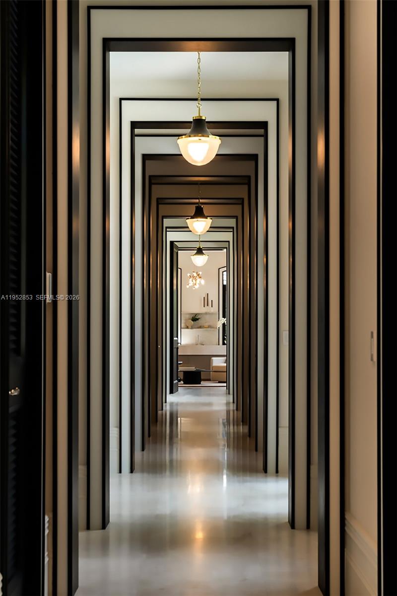 5901 Southwest 107th Street Pinecrest, FL 33156 - Photo 16 of 47 a view of a hallway with wooden floor and a fireplace