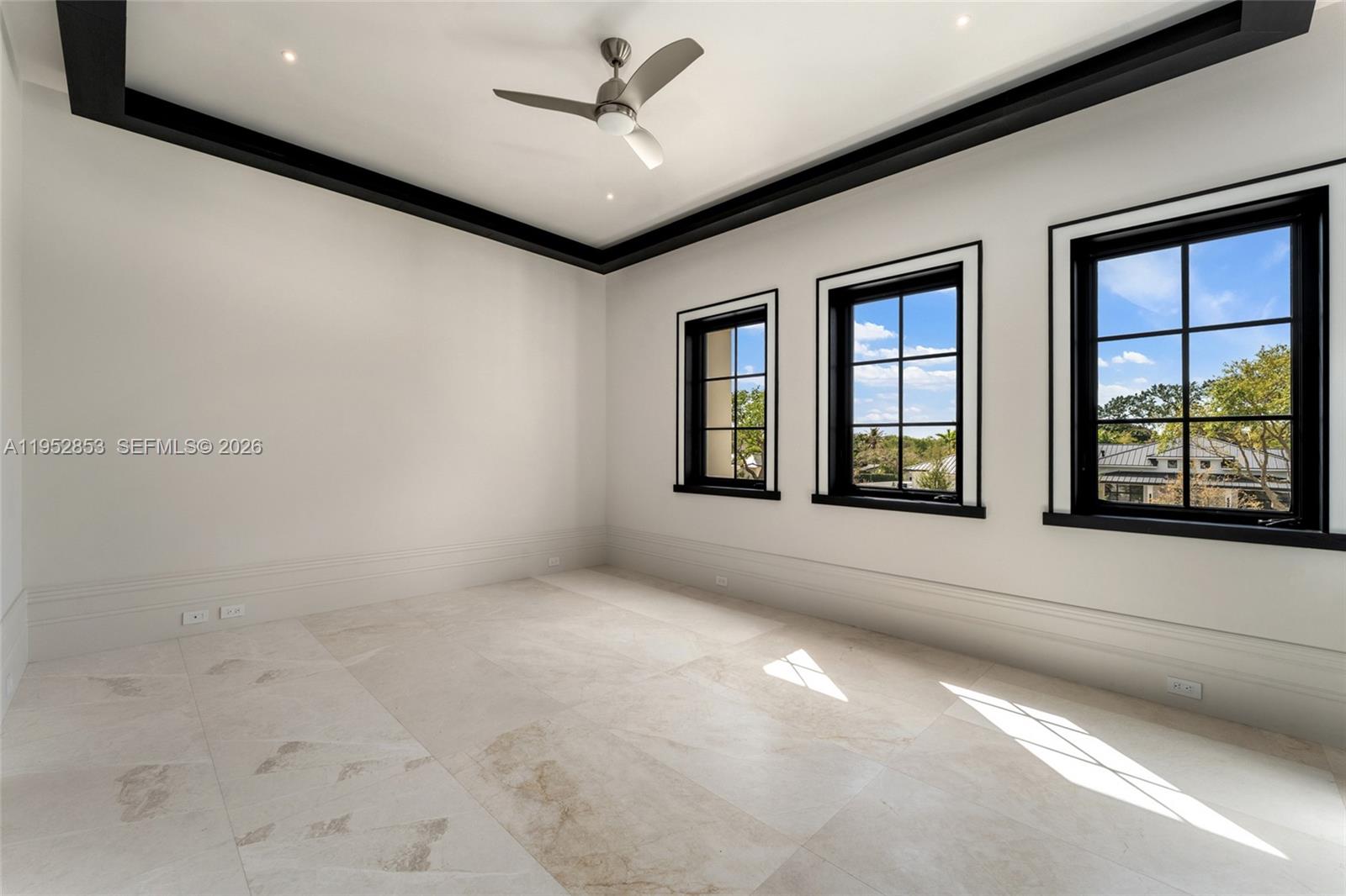 5901 Southwest 107th Street Pinecrest, FL 33156 - Photo 28 of 47 a view of an empty room with a window