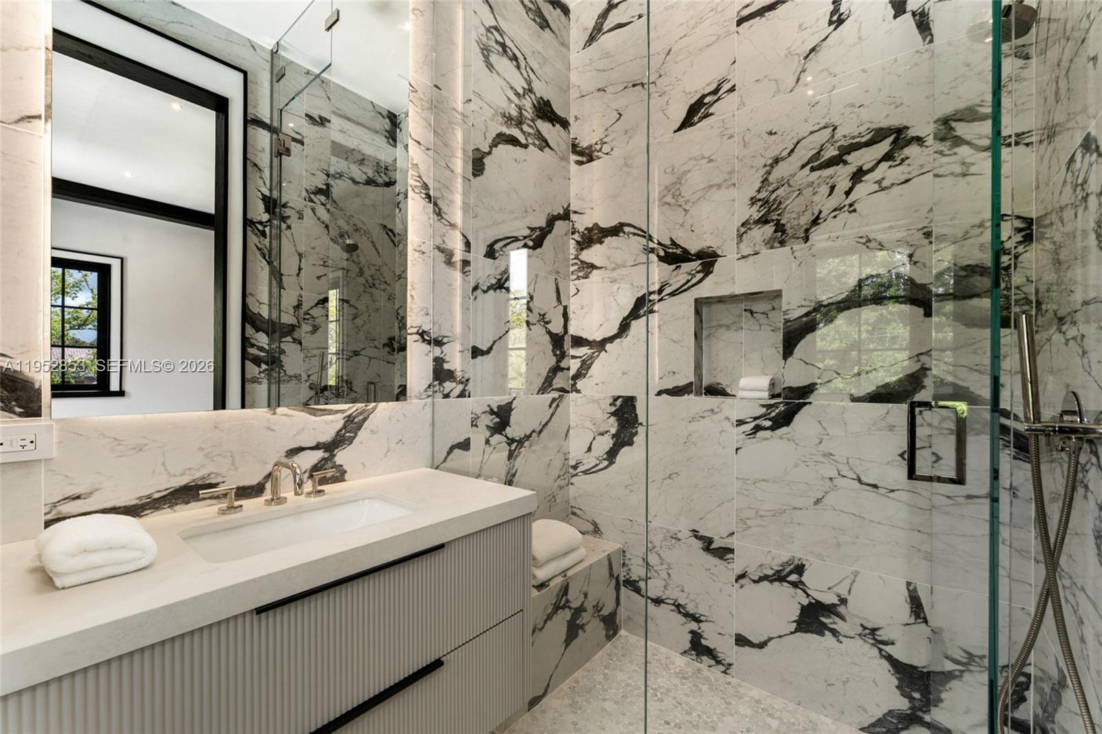 5901 Southwest 107th Street Pinecrest, FL 33156 - Photo 29 of 47 a bathroom with a sink mirror and toilet