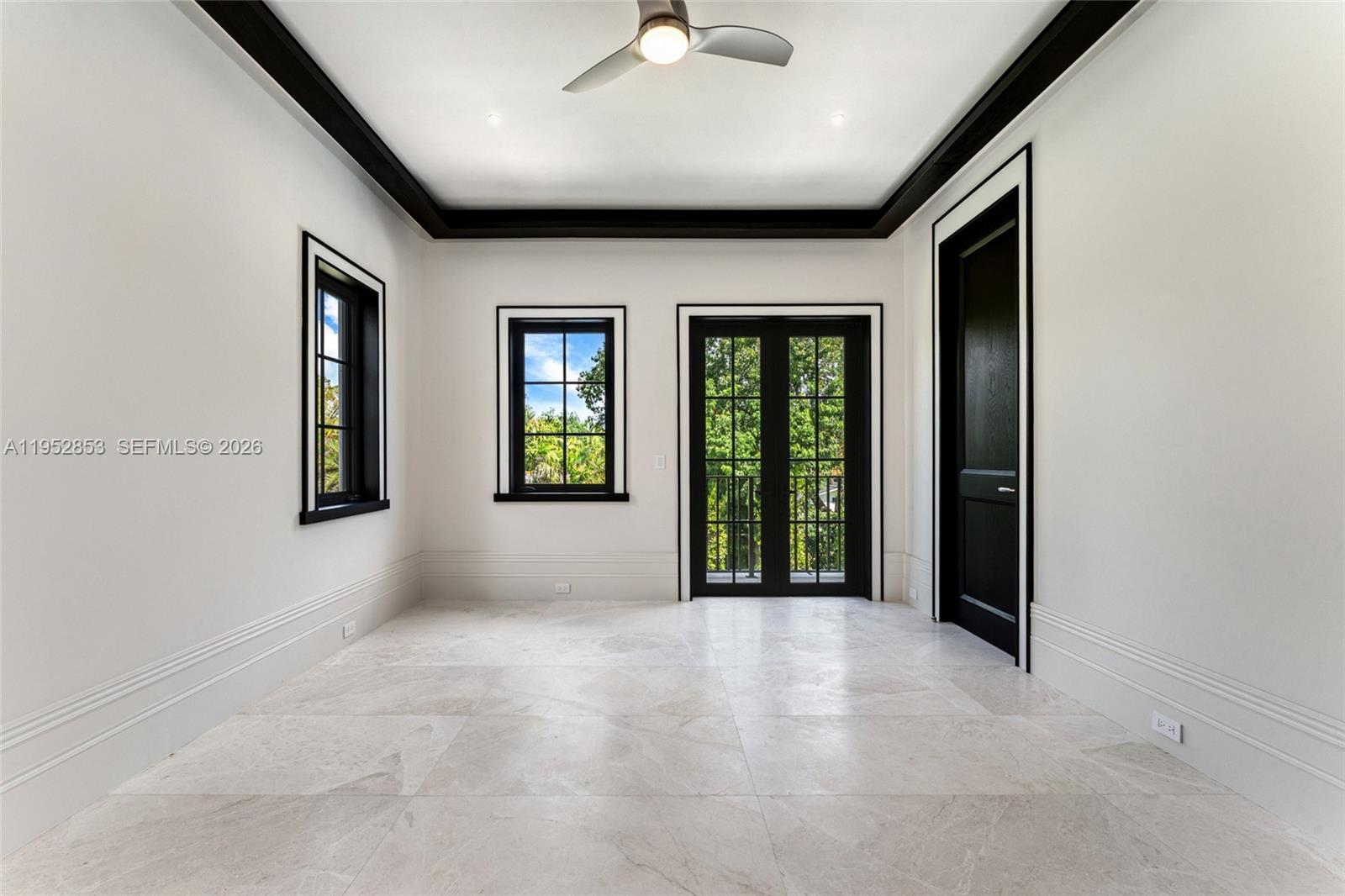 5901 Southwest 107th Street Pinecrest, FL 33156 - Photo 30 of 47 an empty room with windows and closet