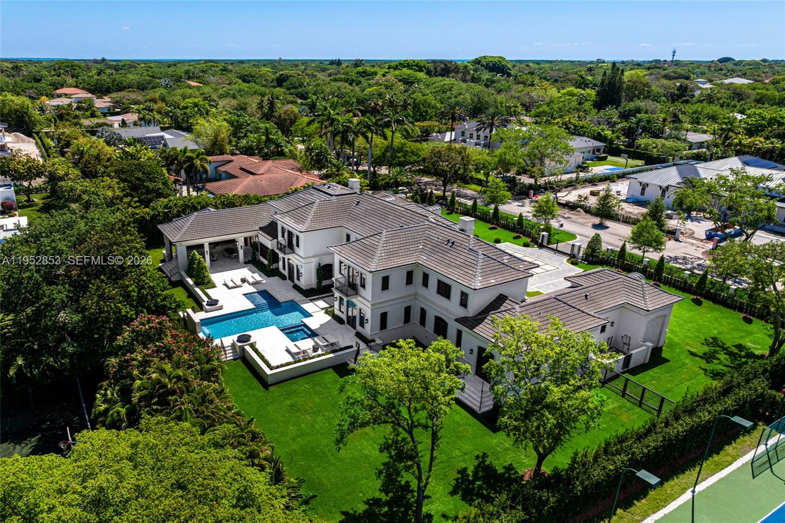 5901 Southwest 107th Street Pinecrest, FL 33156 - Photo 37 of 47 an aerial view of a house with a garden