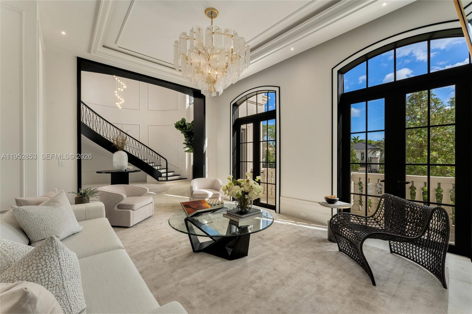 5901 Southwest 107th Street Pinecrest, FL 33156 - Photo 9 of 47 a lobby with furniture and floor to ceiling window