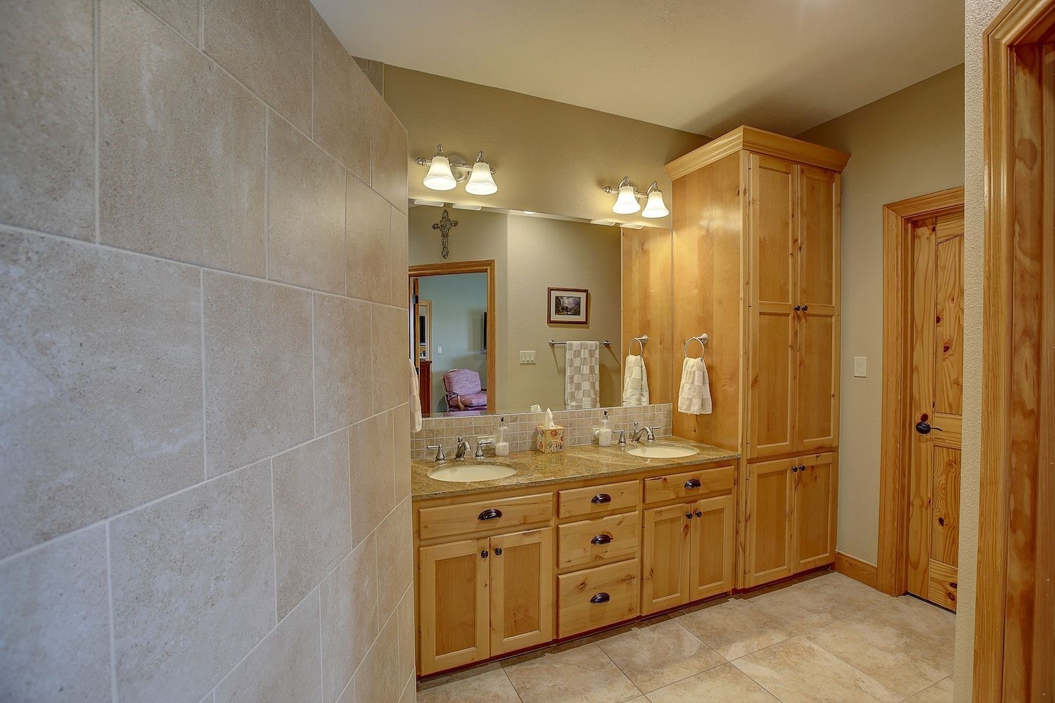 9414 Laird Road Round Top, TX 78954 - Photo 36 of 50 Shower exterior wall next to the primary bath cabinetry and sinks
