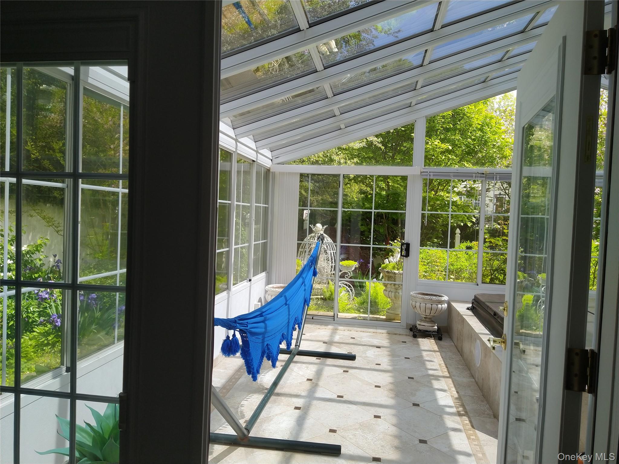 1155 Webster Avenue New Rochelle, NY 10804 - Photo 18 of 35 a view of balcony with two couches and wooden floor