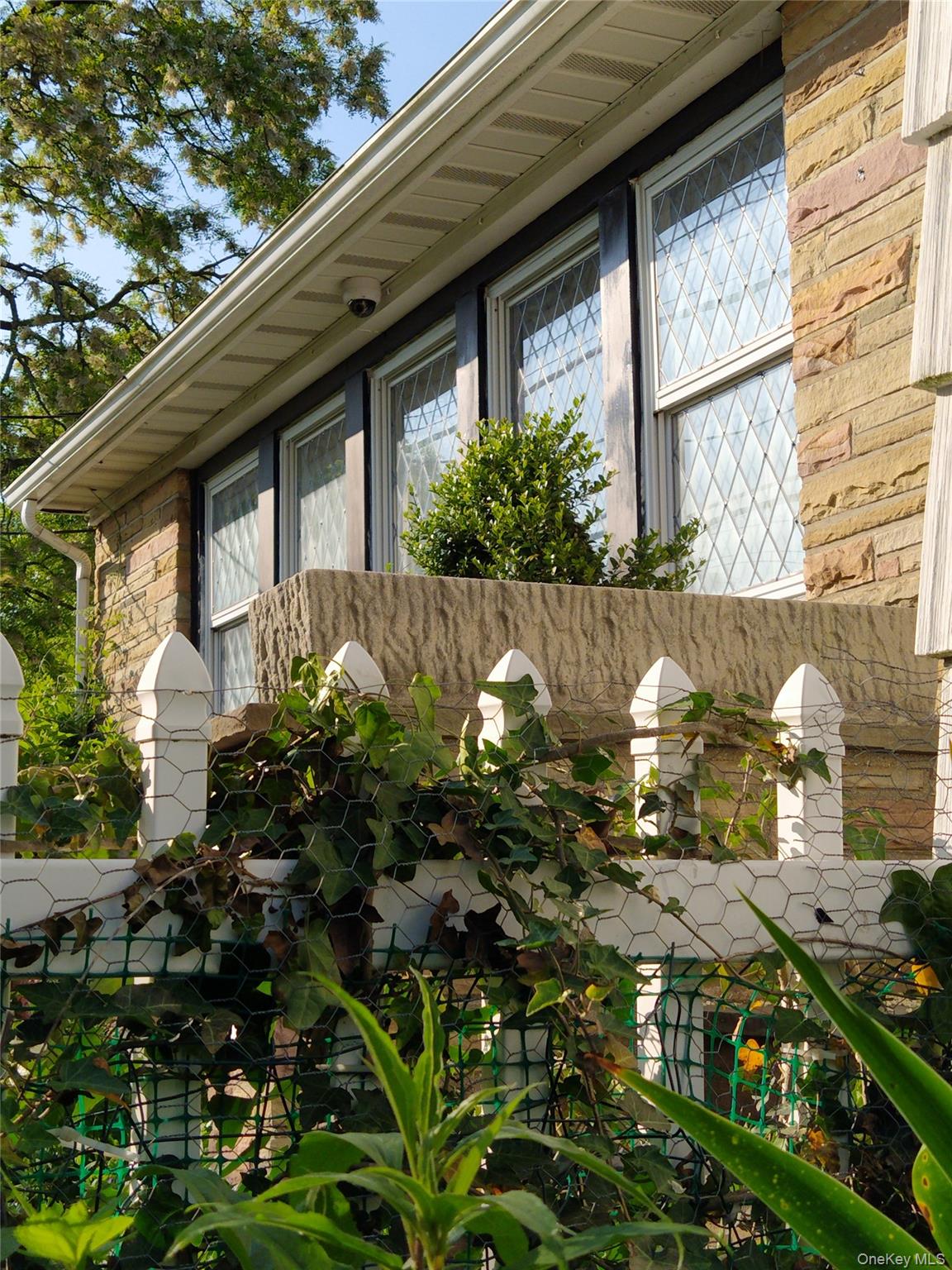 1155 Webster Avenue New Rochelle, NY 10804 - Photo 2 of 35 a front view of a house with a yard