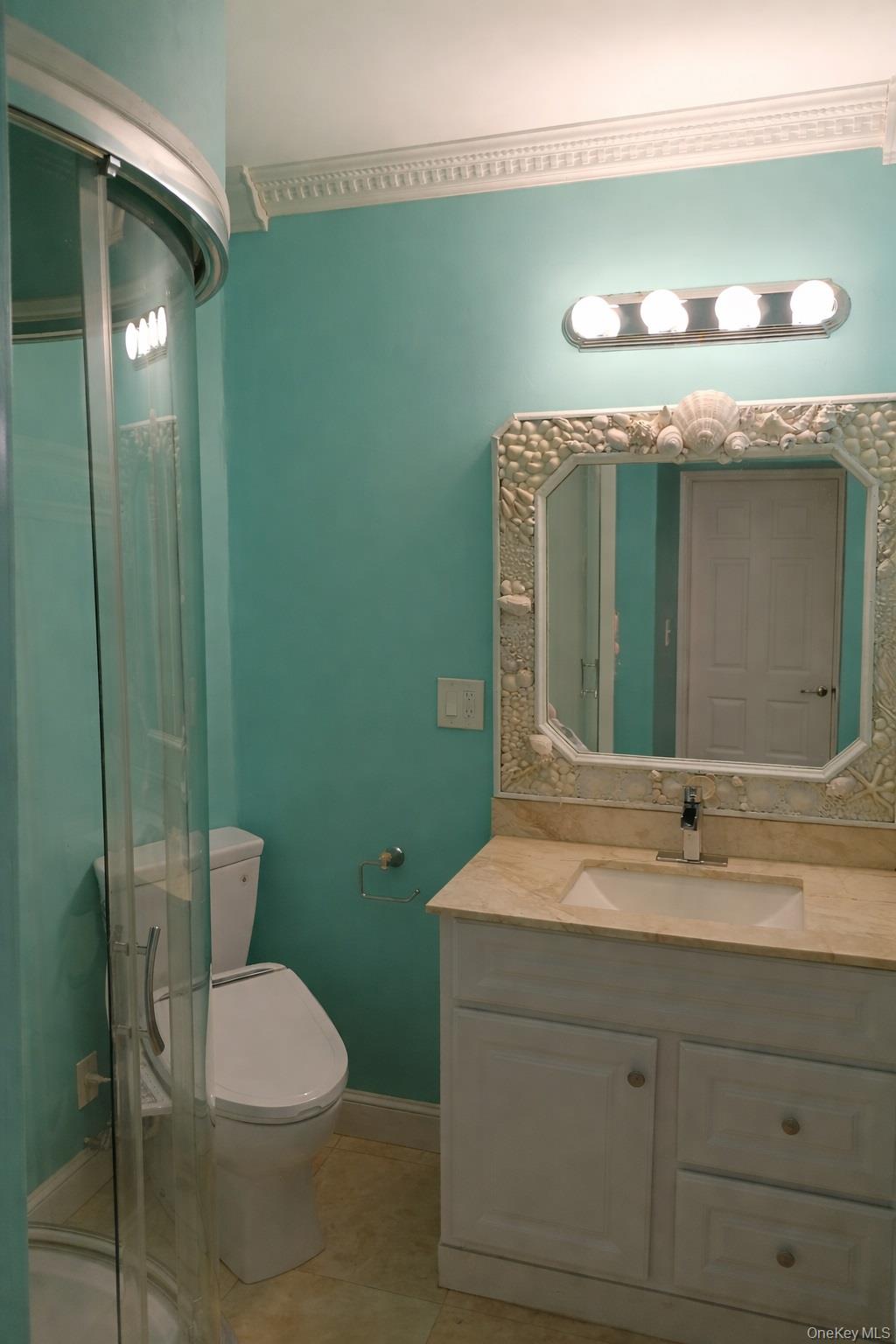 1155 Webster Avenue New Rochelle, NY 10804 - Photo 23 of 35 a bathroom with a toilet sink and mirror