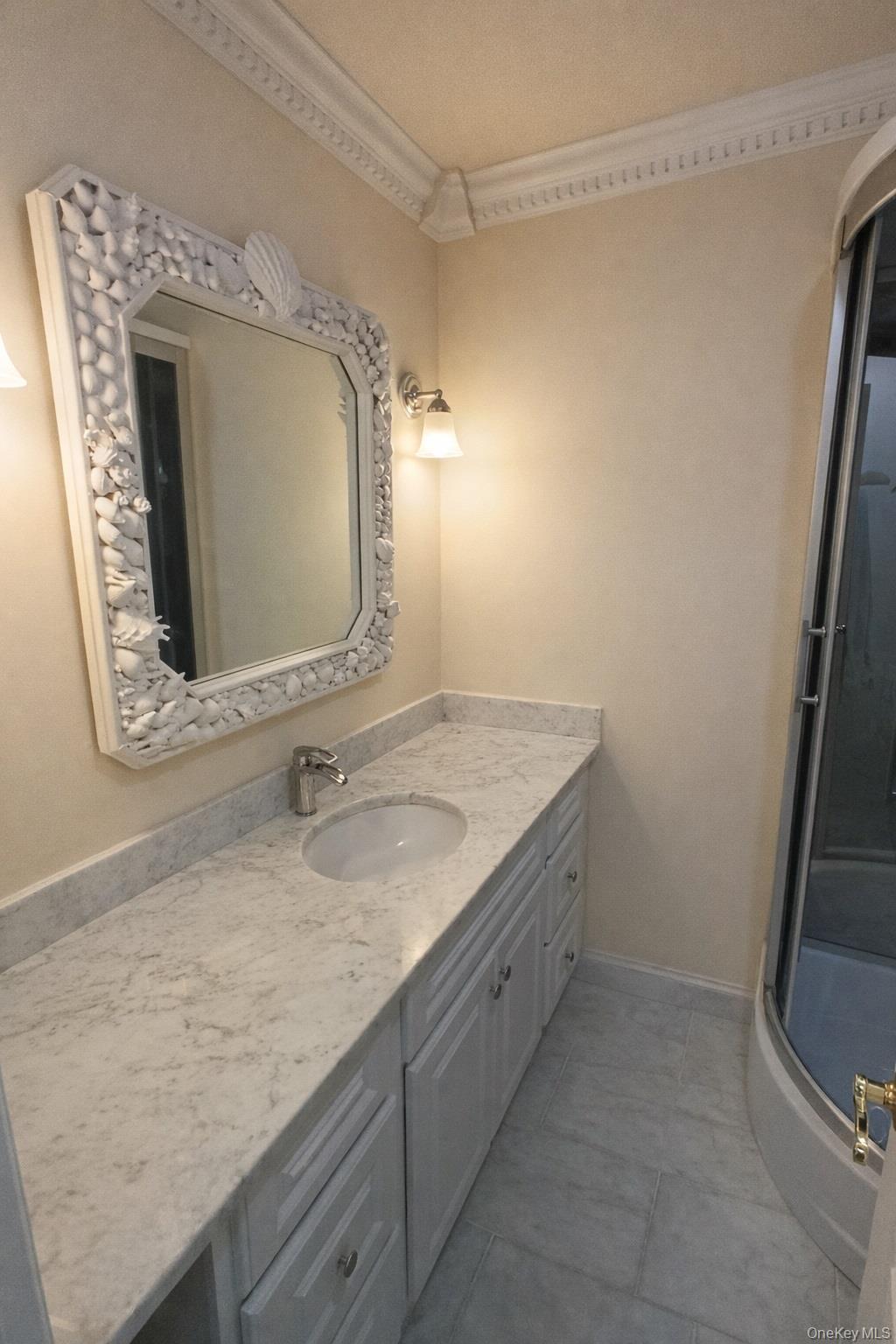 1155 Webster Avenue New Rochelle, NY 10804 - Photo 24 of 35 a bathroom with a granite countertop sink and a mirror