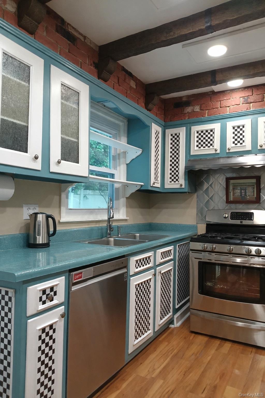 1155 Webster Avenue New Rochelle, NY 10804 - Photo 35 of 35 a kitchen with stainless steel appliances granite countertop a stove and a sink